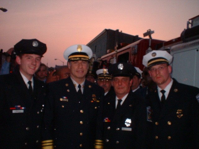 Chip McLean, John Travolta, Alan David & Blaine Leis during the filming of Ladder 49 in Baltimore Maryland