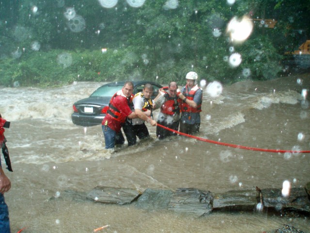 FF Culbertson, FF Magnatta & AC Remillard making the rescue at the Ford.  Moments after they pulled the driver out of the car, it was swept downstream rolling over!  Township Citations were awarded to these three brave men along with a Unit Citation for all those working the incident.